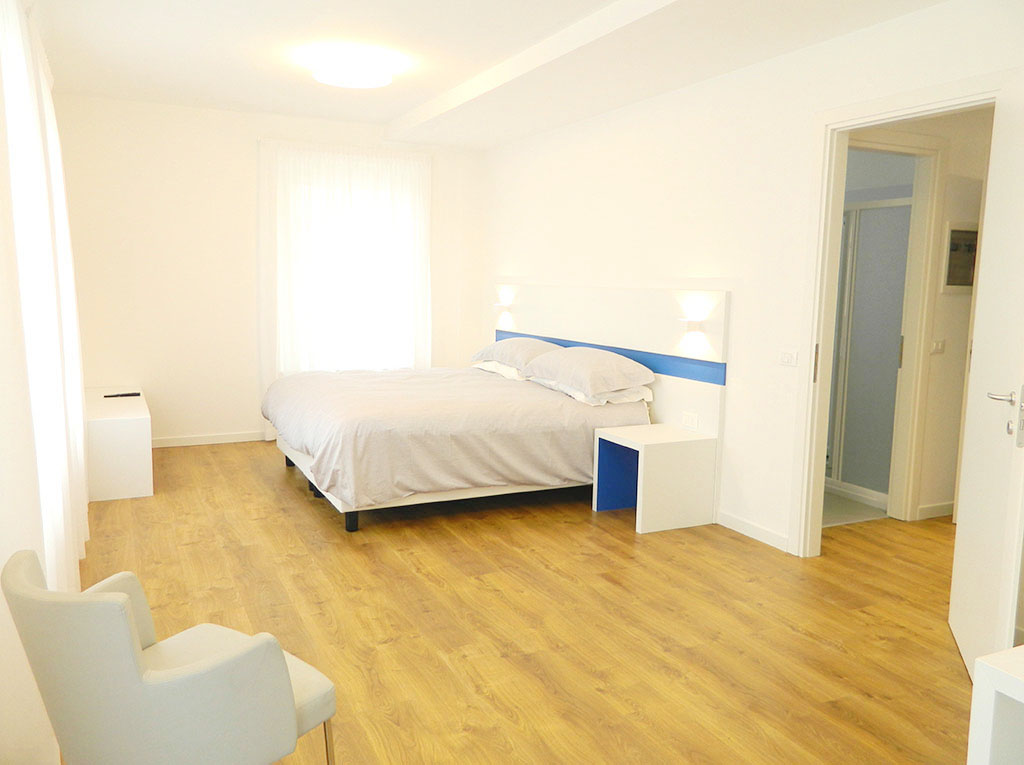 Zona soggiorno dell'appartamento Deluxe 60 mq con angolo cottura, Palamostre Residence, Udine